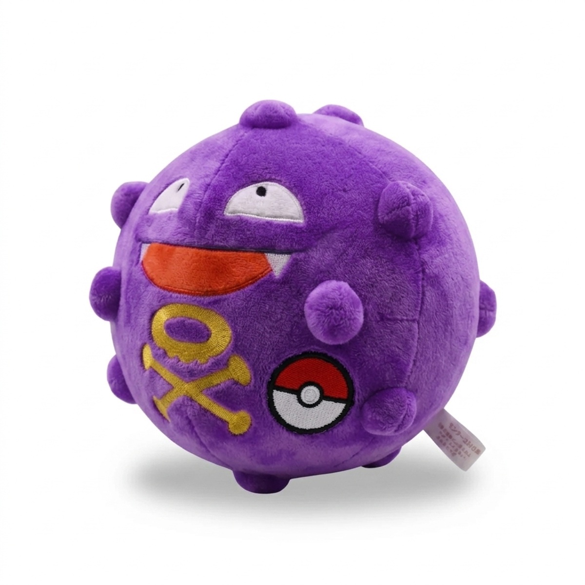 Koffing Knuffel met badge die de echtheid bewijst.